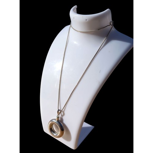 197 - A LARGE SILVER PENDANT WITH SILVER CHAIN