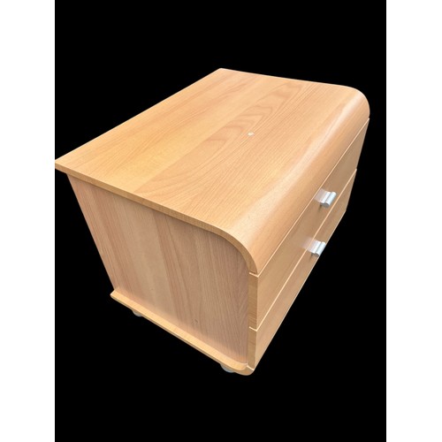 330 - A BEECH 3 DRAWERED SHAPED BEDSIDE