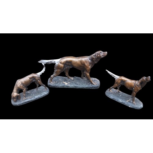 333 - 3 CHALK DOGS OF VARIOUS SIZES (IN A CONVINCING BRONZE FINISH)