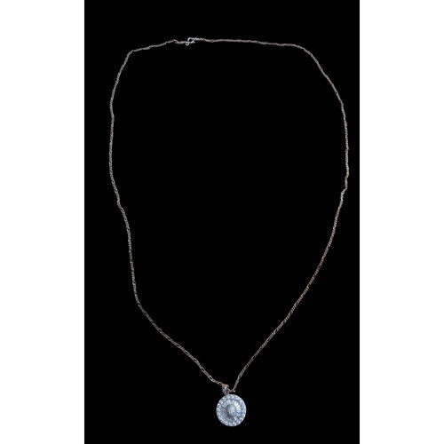 228 - A VERY LONG SILVER CHAIN WITH A SILVER CIRCULAR DESIGNER GEM SET PENDANT