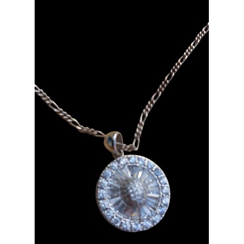 228 - A VERY LONG SILVER CHAIN WITH A SILVER CIRCULAR DESIGNER GEM SET PENDANT