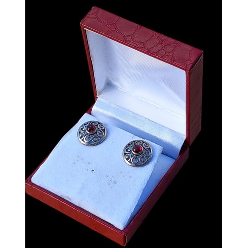 254 - A PAIR OF CELTIC SHIELD EARRINGS SET WITH GARNET STONES