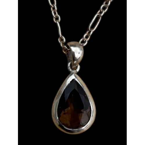 258 - A TEAR DROP SILVER SMOKEY QUARTZ PENDANT OF GOOD QUALITY ON A GOOD SILVER CHAIN