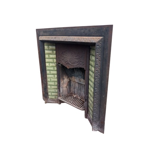 288 - AN ANTIQUE CAST FIREPLACE WITH GREEN TILES  38X39