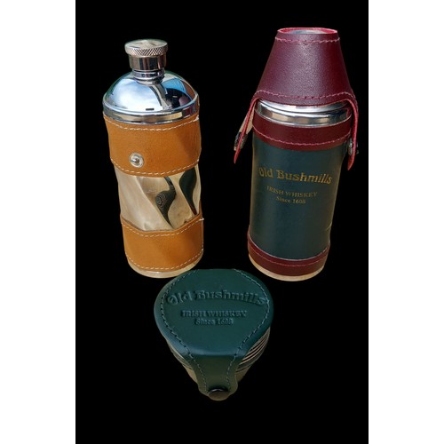 397 - A BUSHMILLS MINI FLASK WITH MEASURE & 1 OTHER VINTAGE ONE ALONG WITH A BUSHMILLS LEATHER CASED MEASU... 