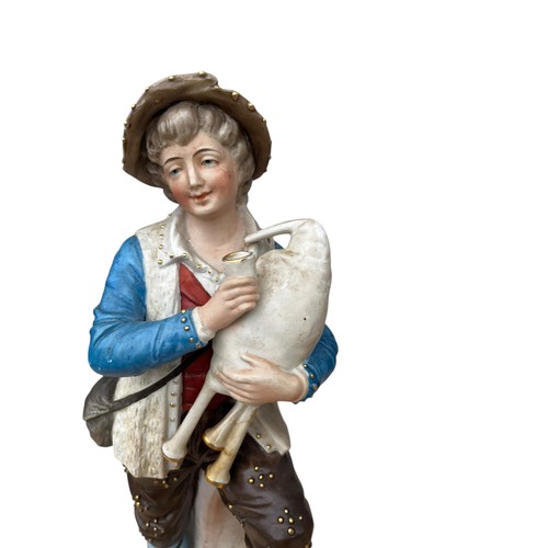 53 - A PAIR OF BISQ FIGURINES 14