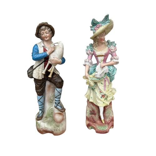 53 - A PAIR OF BISQ FIGURINES 14