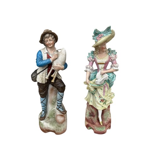 53 - A PAIR OF BISQ FIGURINES 14