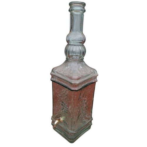 71 - A LARGE GLASS WINE DESPENSER IN A VINEYARD DESIGN 18