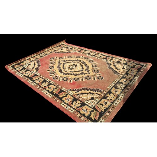 79 - A RED PATTERNED RUG MEASURING 180 x 250