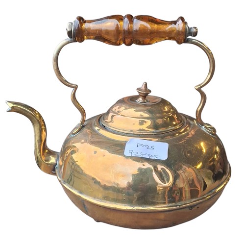88 - A BRASS KETTLE WITH AMBER HANDLE