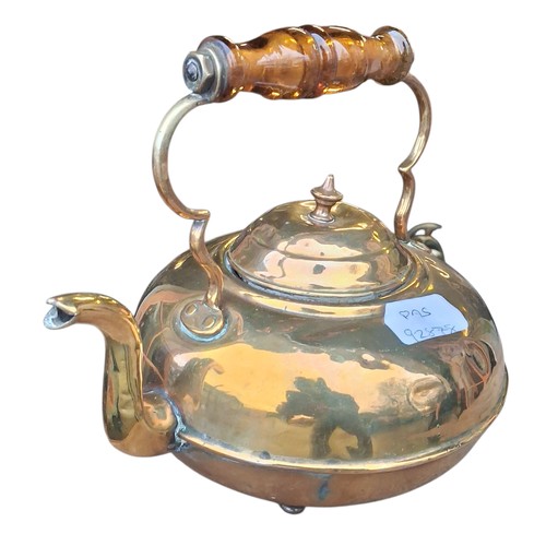 88 - A BRASS KETTLE WITH AMBER HANDLE