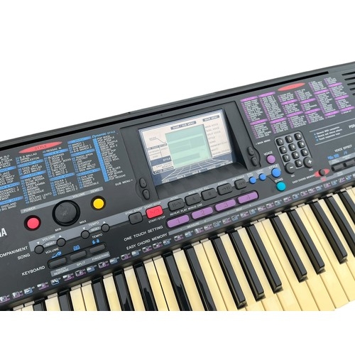 109 - A YAMAHA KEYBOARD ON STAND