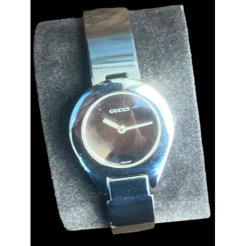 235 - LADIES GUCCI STAINLESS STEEL BANGLE WATCH FEATURE CLASP ,MIRROR PLAIN DIAL  QURTZ AND WORKING SAPPHI... 