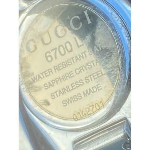 235 - LADIES GUCCI STAINLESS STEEL BANGLE WATCH FEATURE CLASP ,MIRROR PLAIN DIAL  QURTZ AND WORKING SAPPHI... 