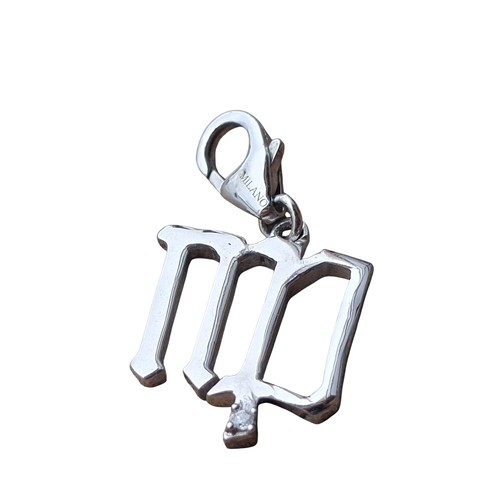 239 - A DIAMOND AND STERLING SILVER MILANO ZODIAC 
