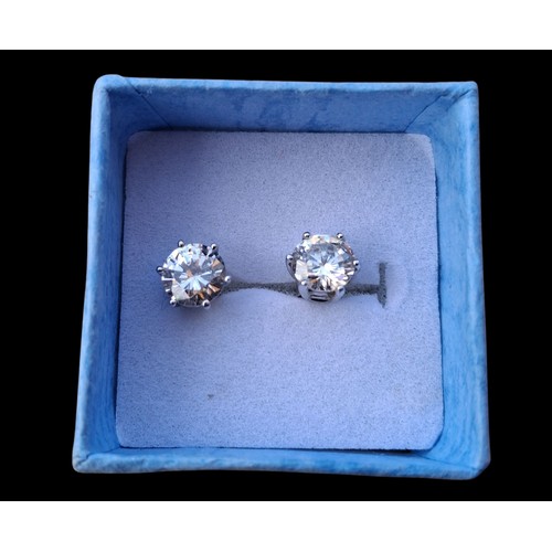 241 - A PAIR OF SILVER SOLITAIRE EARRINGS