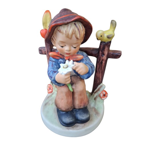 243 - A HUMMEL FIGURE BOY WITH DAISY