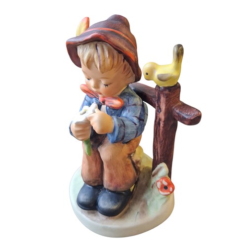 243 - A HUMMEL FIGURE BOY WITH DAISY