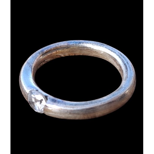 244 - A MATT FINISHED SILVER SOLITAIRE RING