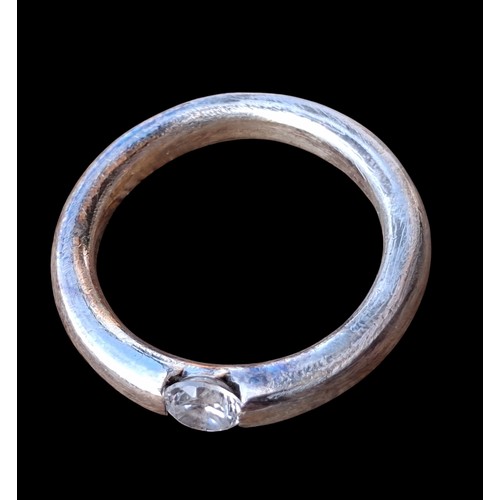 244 - A MATT FINISHED SILVER SOLITAIRE RING