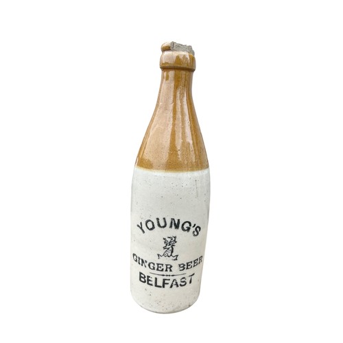 251 - A YOUNG'S GINGER BEER BELFAST STONEWARE BOTTLE (DAMAGE TO RIM AS PER PHOTO)