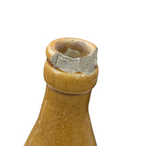 251 - A YOUNG'S GINGER BEER BELFAST STONEWARE BOTTLE (DAMAGE TO RIM AS PER PHOTO)