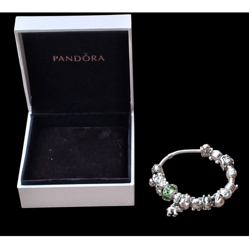 283 - A HEAVY GENIUNE SILVER PANDORA BRACELET WITH CHARMS (72.5G)