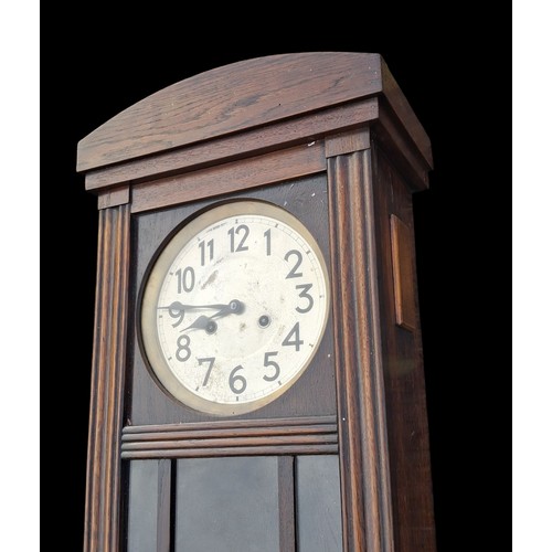 110A - A VINTAGE STYLE OAK CASE WALL CLOCK