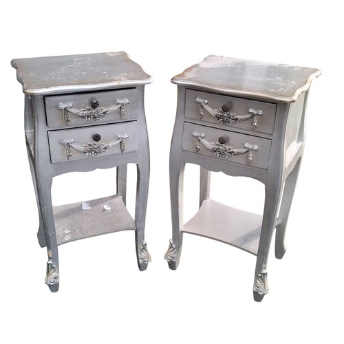 72 - A PAIR OF ORNATE SILVER FINISHED 2 DRAWERED LAMP TABLES 29.5