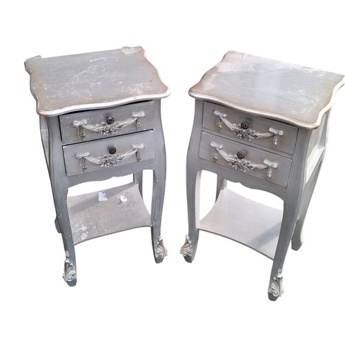 72 - A PAIR OF ORNATE SILVER FINISHED 2 DRAWERED LAMP TABLES 29.5