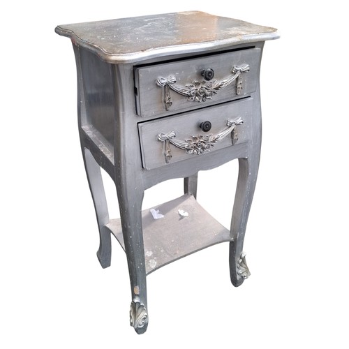 72 - A PAIR OF ORNATE SILVER FINISHED 2 DRAWERED LAMP TABLES 29.5