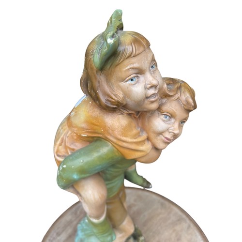 96 - A LARGE HAND PAINTED PARIAN BOY AND GIRL GROUP WITH SOME AGE STANDS 20