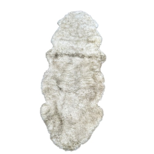 103 - A SHEEP SKIN RUG
