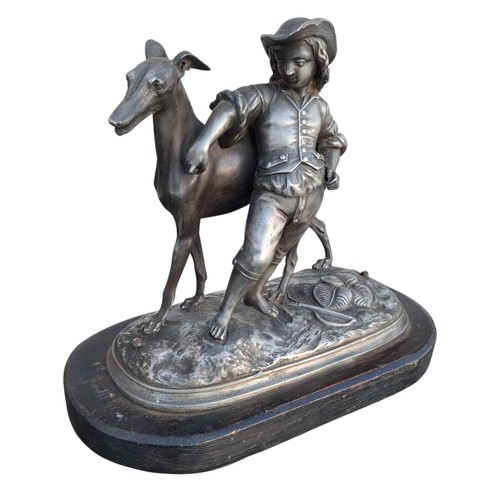 14 - A SILVERED METAL ANTIQUE BOY AND GREY HOUND FIG 9
