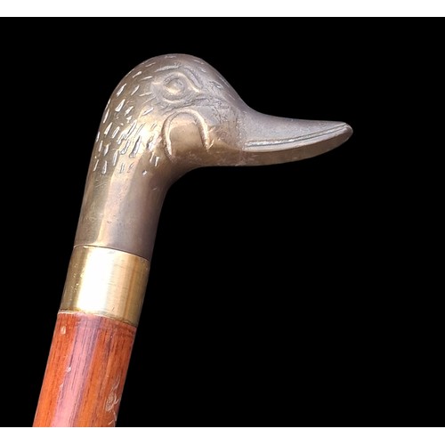 26 - A VINTAGE WALKING STICK WITH BRASS DUCKS HEAD HANDLE