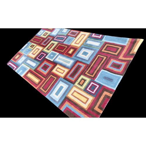 20 - A LARGE MULTI COLOURED RUG BY DEKKO 60x120