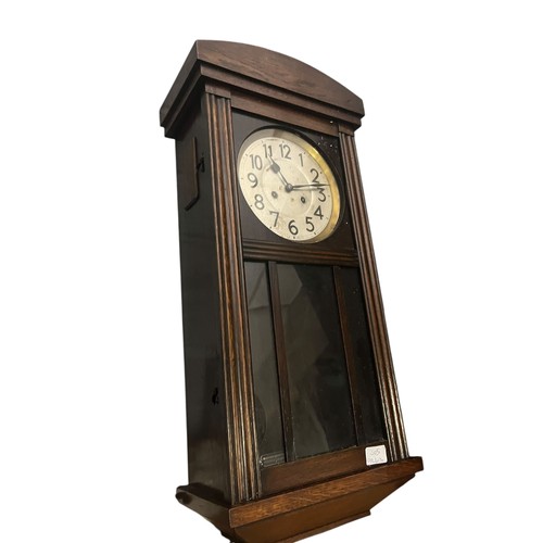 43 - A GERMAN OAK CASED WALL CLOCK