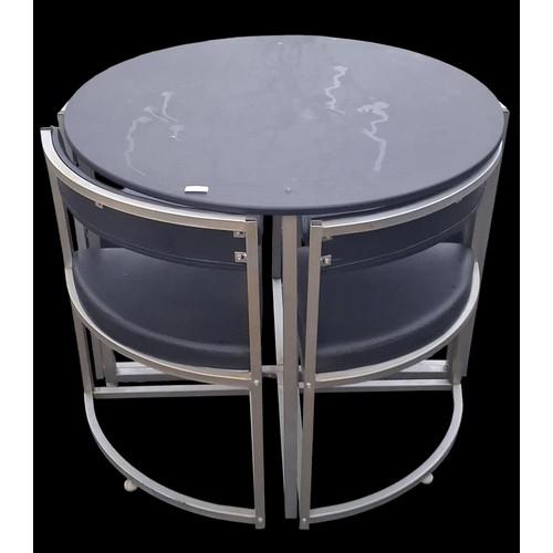 95 - A CIRCULAR TABLE WITH 4 FITTED CHAIRS
