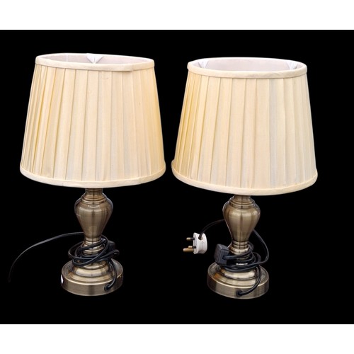 62 - A PAIR OF BRONZED FINISHED LAMPS