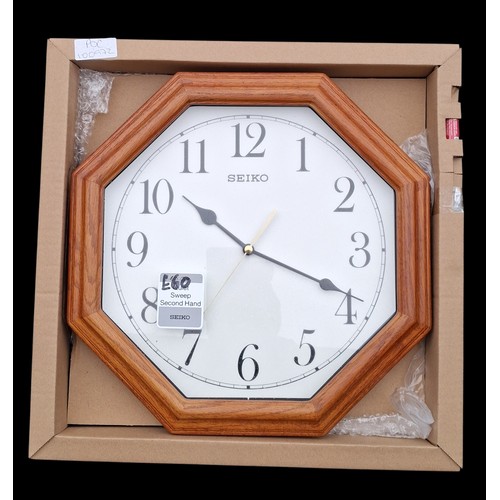 106 - A BRAND NEW OCTAGONAL OAK FRAMED SEIKO CLOCK IN BOX R.R.P£60