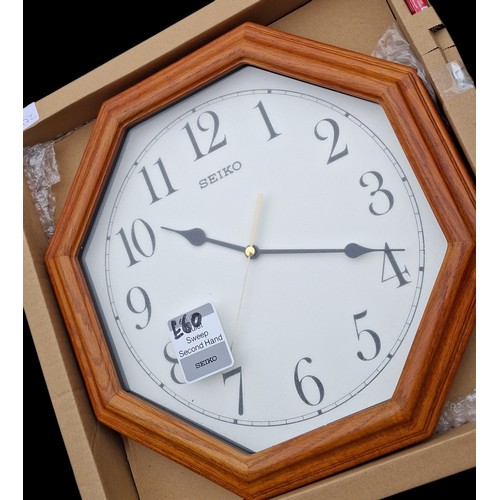106 - A BRAND NEW OCTAGONAL OAK FRAMED SEIKO CLOCK IN BOX R.R.P£60