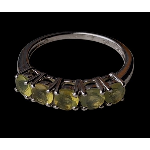 305 - A SILVER RING SET WITH YELLOW STONES