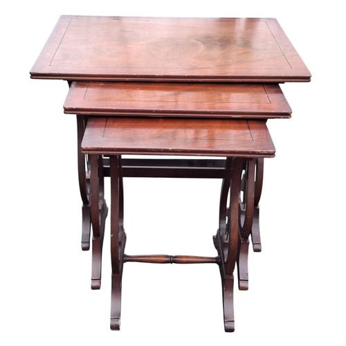 308 - A NEST OF INLAID MAHOGANY TABLES