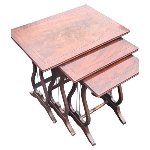 308 - A NEST OF INLAID MAHOGANY TABLES
