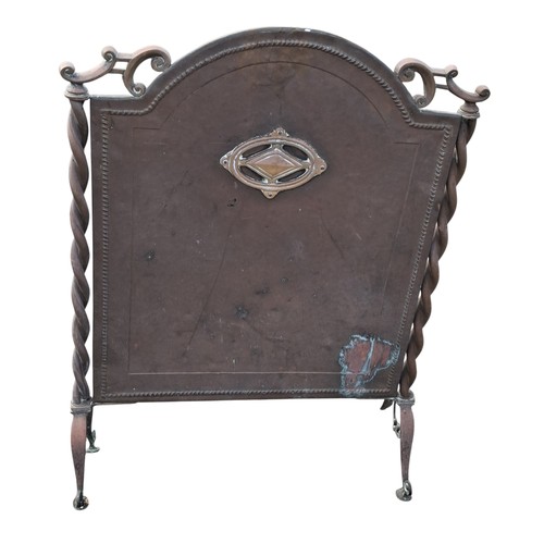73 - A COPPER FIRE SCREEN WITH TWIST DESIGN
