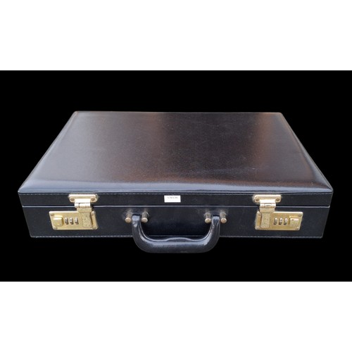 74 - A BRIEFCASE WITH COMBINATION