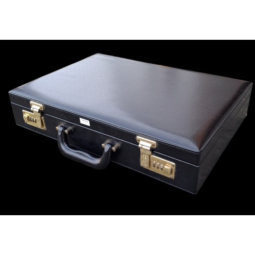 74 - A BRIEFCASE WITH COMBINATION