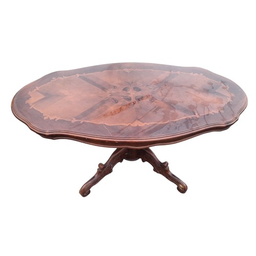 93 - A MARQ INLIAD COFFEE TABLE ON A QUAD BASE