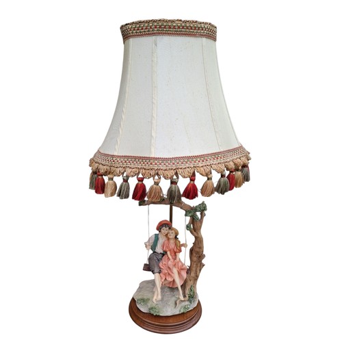 66 - A FIGURINE LAMP